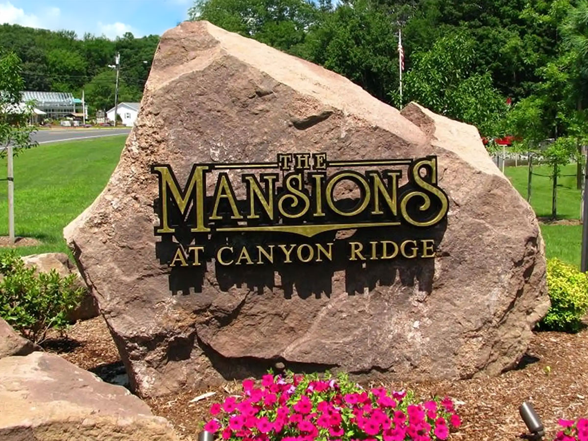 Entrance signage for mansions at Canyon Ridge